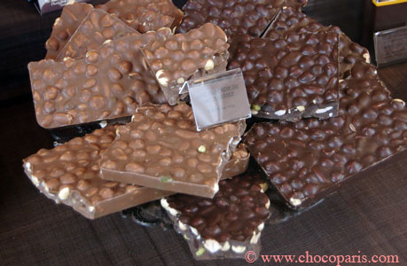 Pieces of milk and dark chocolate with hazelnuts milk chocolate and dark chocolate with hazelnuts