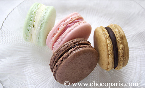 four macarons on a plate